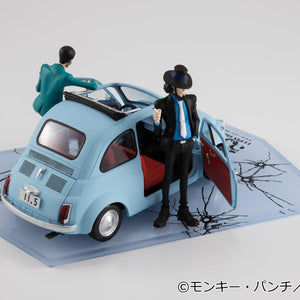 Daisuke Jigen figure standing beside the open driver door of the ice blue car.