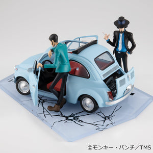 Rear elevated view of the 1/20 scale ice blue car showing open engine hatch alongside figures.