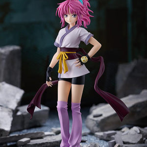 Full view of the Machi collectible figure posed against a dark, urban ruins diorama background.