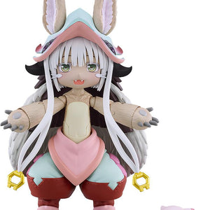 Front view of the Made in Abyss figma Nanachi action figure with open arms and a smiling face plate, isolated on a plain white background alongside a small sleeping Mitty figure.