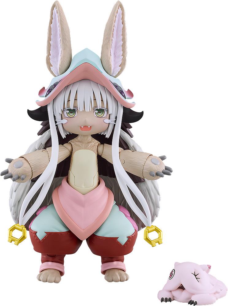 Front view of the Made in Abyss figma Nanachi action figure with open arms and a smiling face plate, isolated on a plain white background alongside a small sleeping Mitty figure.
