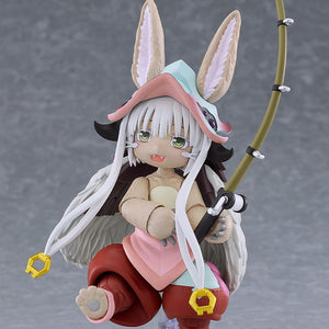 Action pose of the figma Nanachi figure holding the curved fishing rod accessory on a clear display stand.