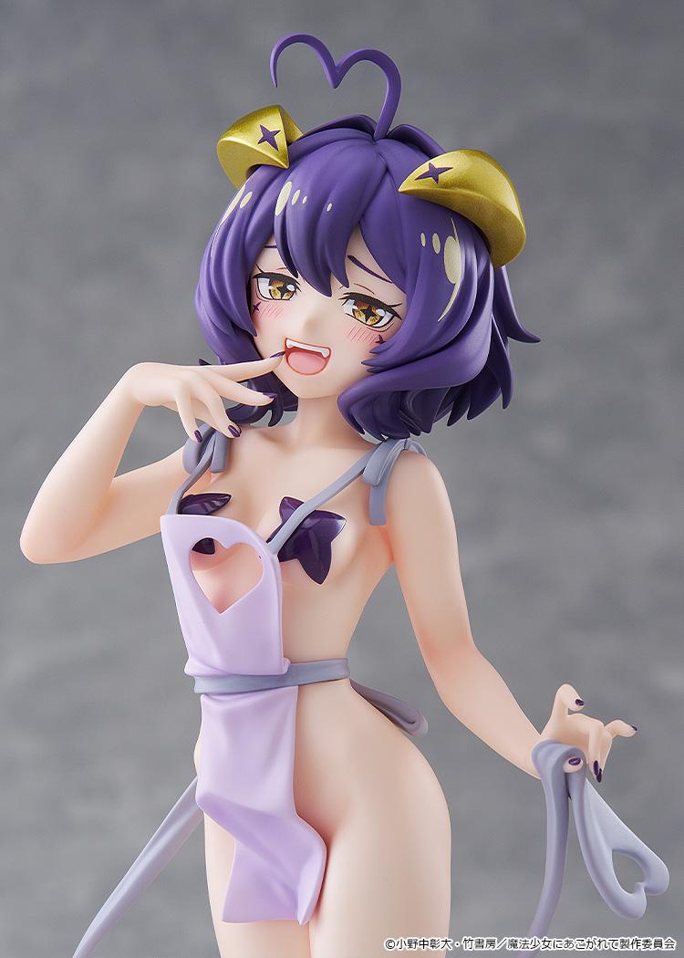 Upper body close-up shot of the Magia Baiser Naked Apron Version figure highlighting her mischievous expression, purple hair, and heart cutout apron detail.
