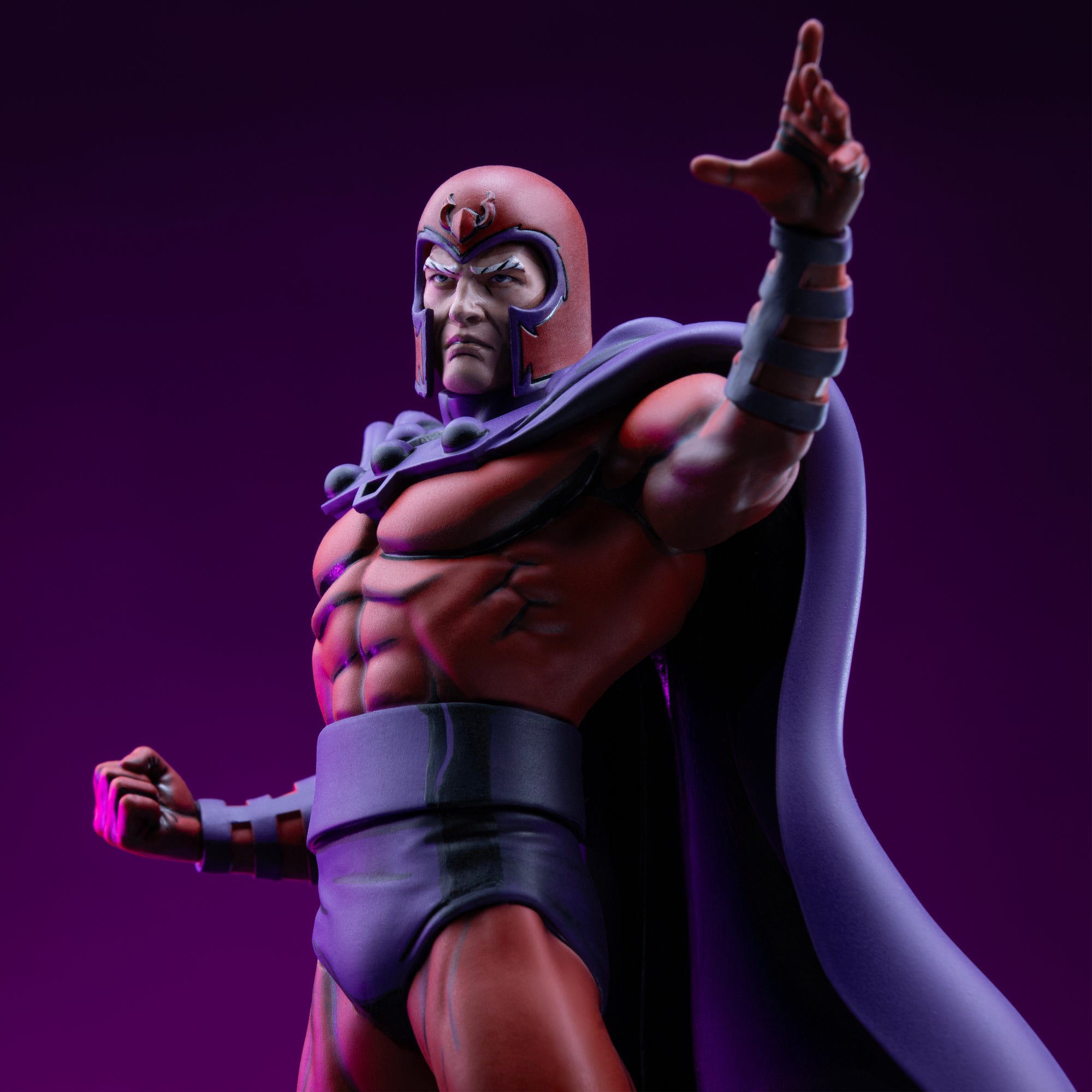 Low-angle torso close-up of Magneto in his iconic red and purple helmet with dramatic purple studio rim lighting.