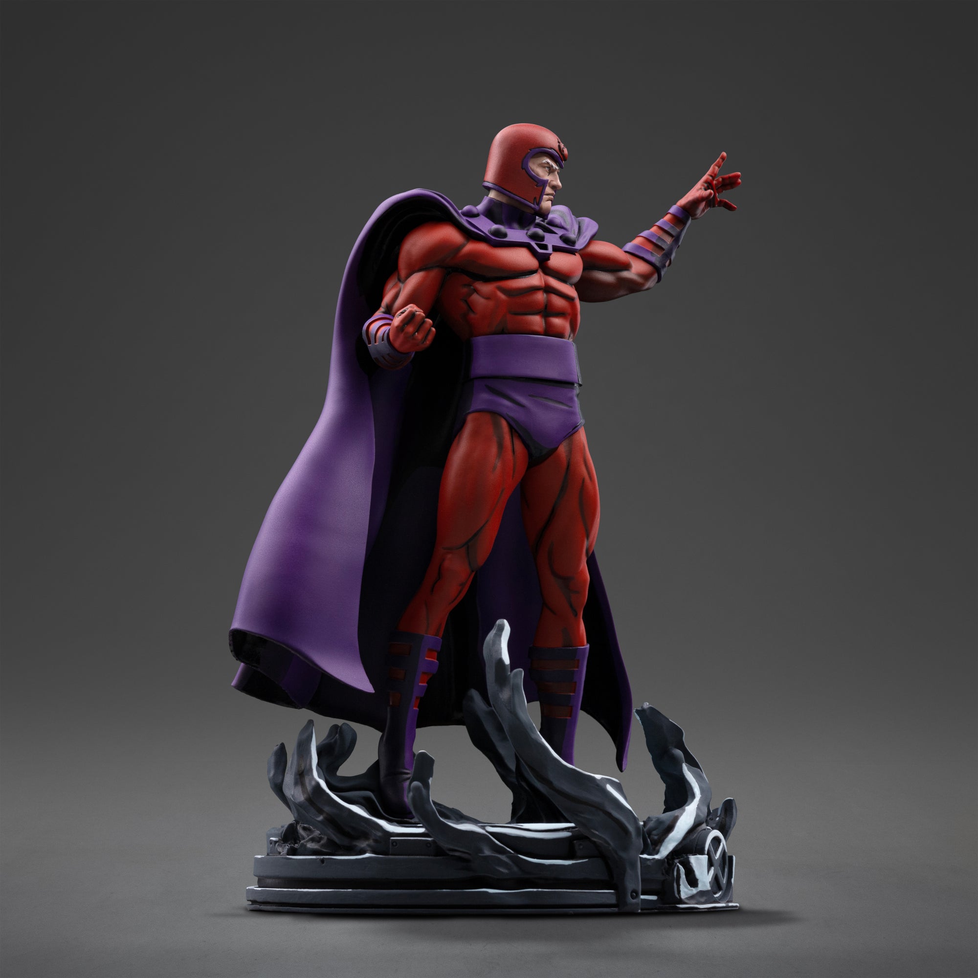 Three-quarter right profile view of the Magneto 1/10 scale statue displaying his muscular suit sculpting and extended left hand.