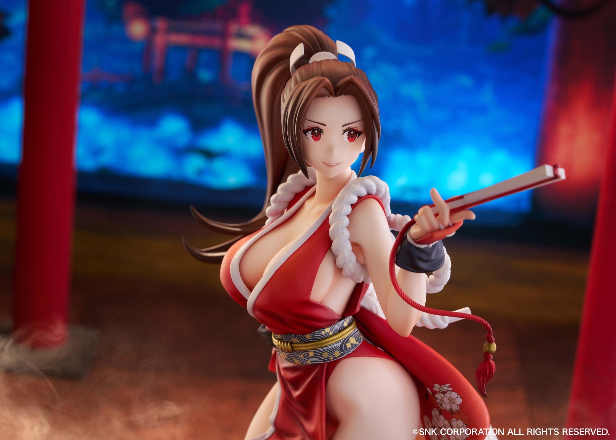 Action-oriented close-up of the Mai Shiranui statue in a vibrant indoor setting.