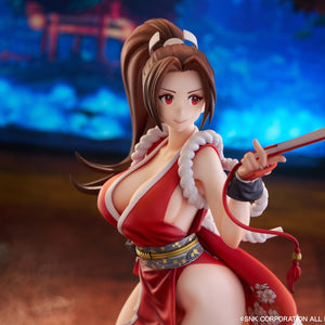 Action-oriented close-up of the Mai Shiranui statue in a vibrant indoor setting.
