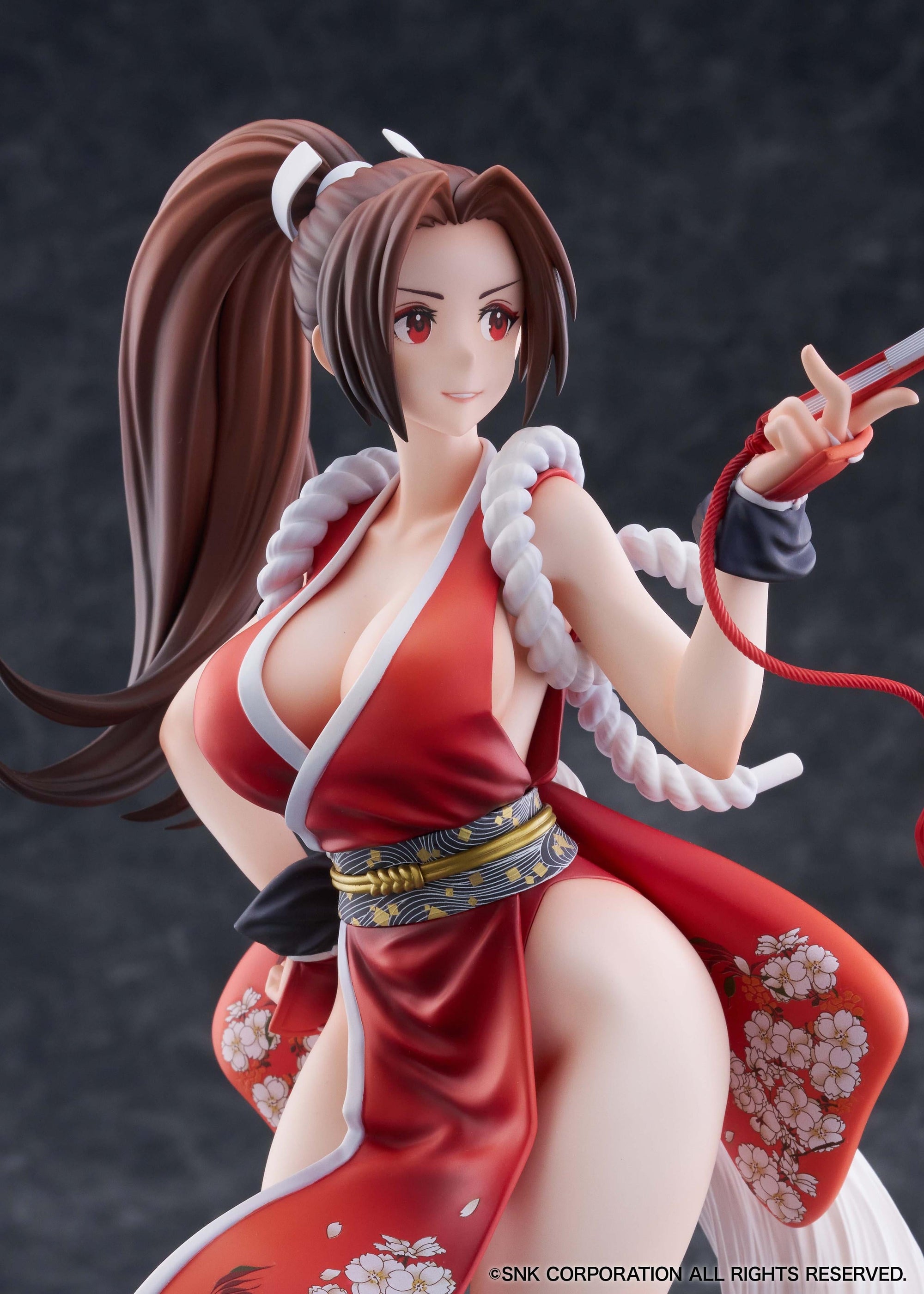 Detailed close-up of Mai Shiranui's face and flamboyant costume details as drawn by artist hncl.