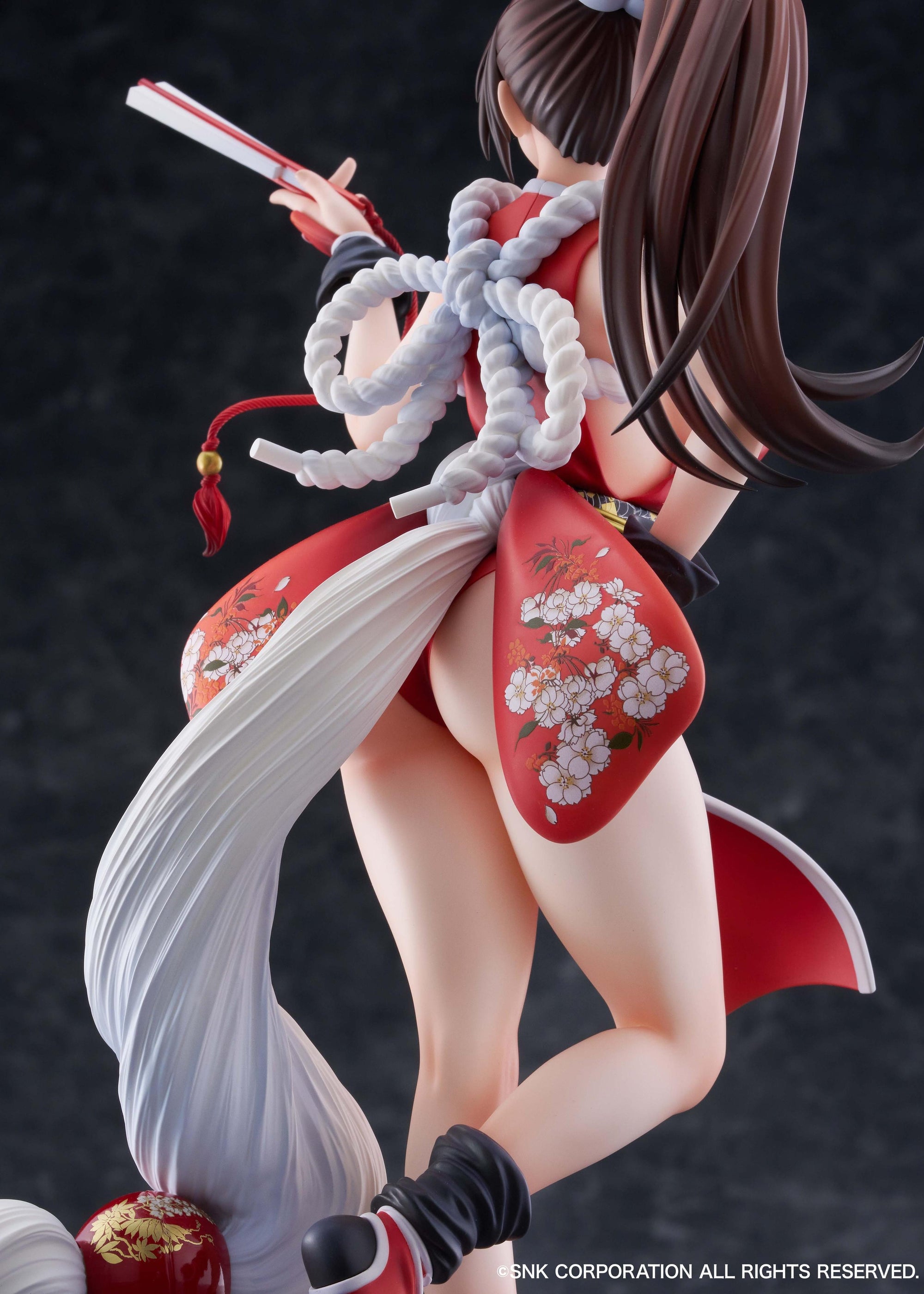 Detailed rear view of Mai Shiranui 1/7 scale figure focusing on the rope belt and floral costume prints.