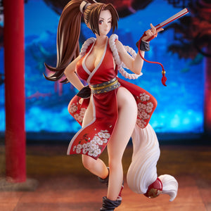Full body shot of Mai Shiranui 1/7 scale figure with winking face in a traditional Japanese temple setting.