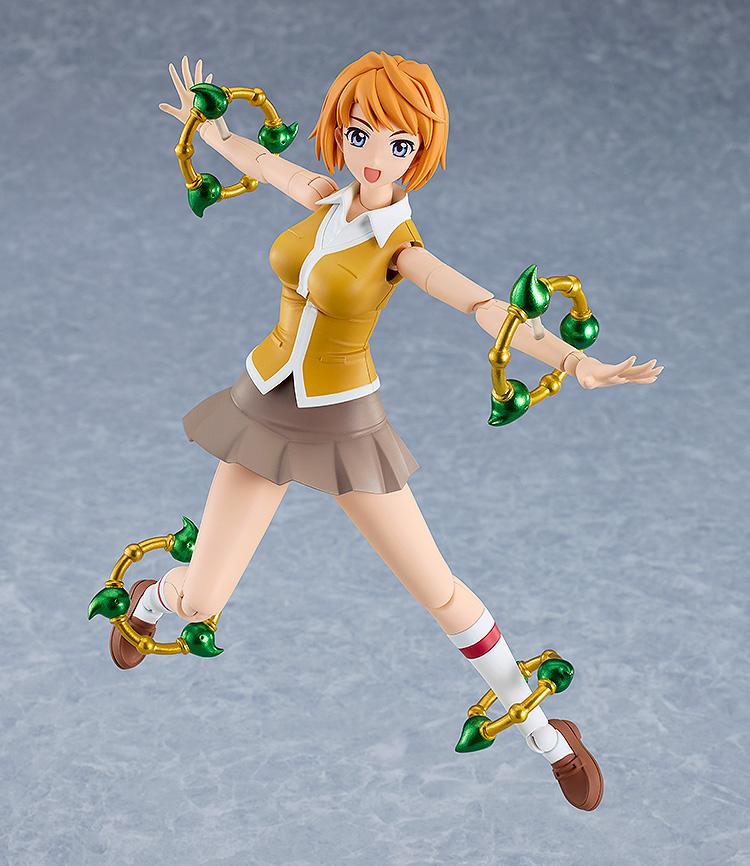 Dynamic action pose of the Mai Tokiha PLAMATEA plastic model kit featuring element rings.