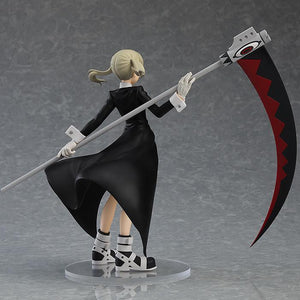 Three-quarter rear view highlighting the dynamic sculpt of Maka's coat and pigtails.