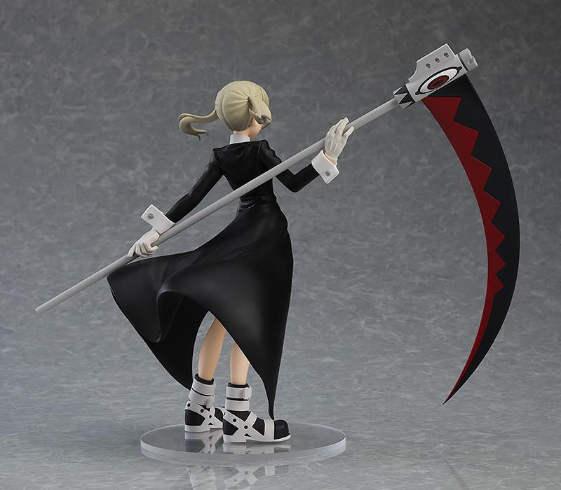 Three-quarter rear view highlighting the dynamic sculpt of Maka's coat and pigtails.