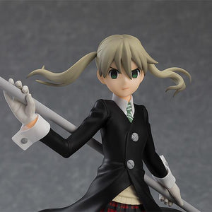 High-detail shot of Maka Albarn's upper body and the mechanical top of her trademark scythe.
