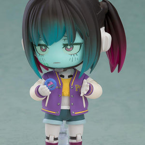 Makina Nendoroid figure holding a small blue badge accessory with colorful graphics.
