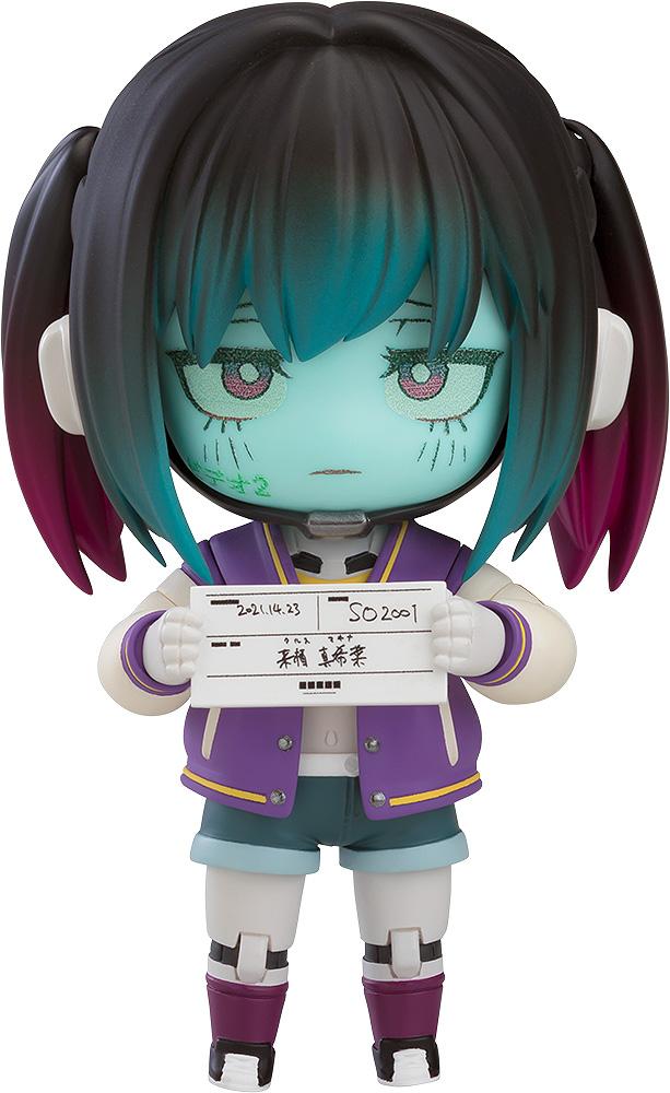 Front view of Milky Subway Makina Nendoroid holding a white mugshot identification paper with Japanese text.