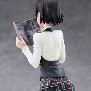Rear close-up of Makoto Niijima showing the realistic printed black-and-white comic interior pages of the magazine.