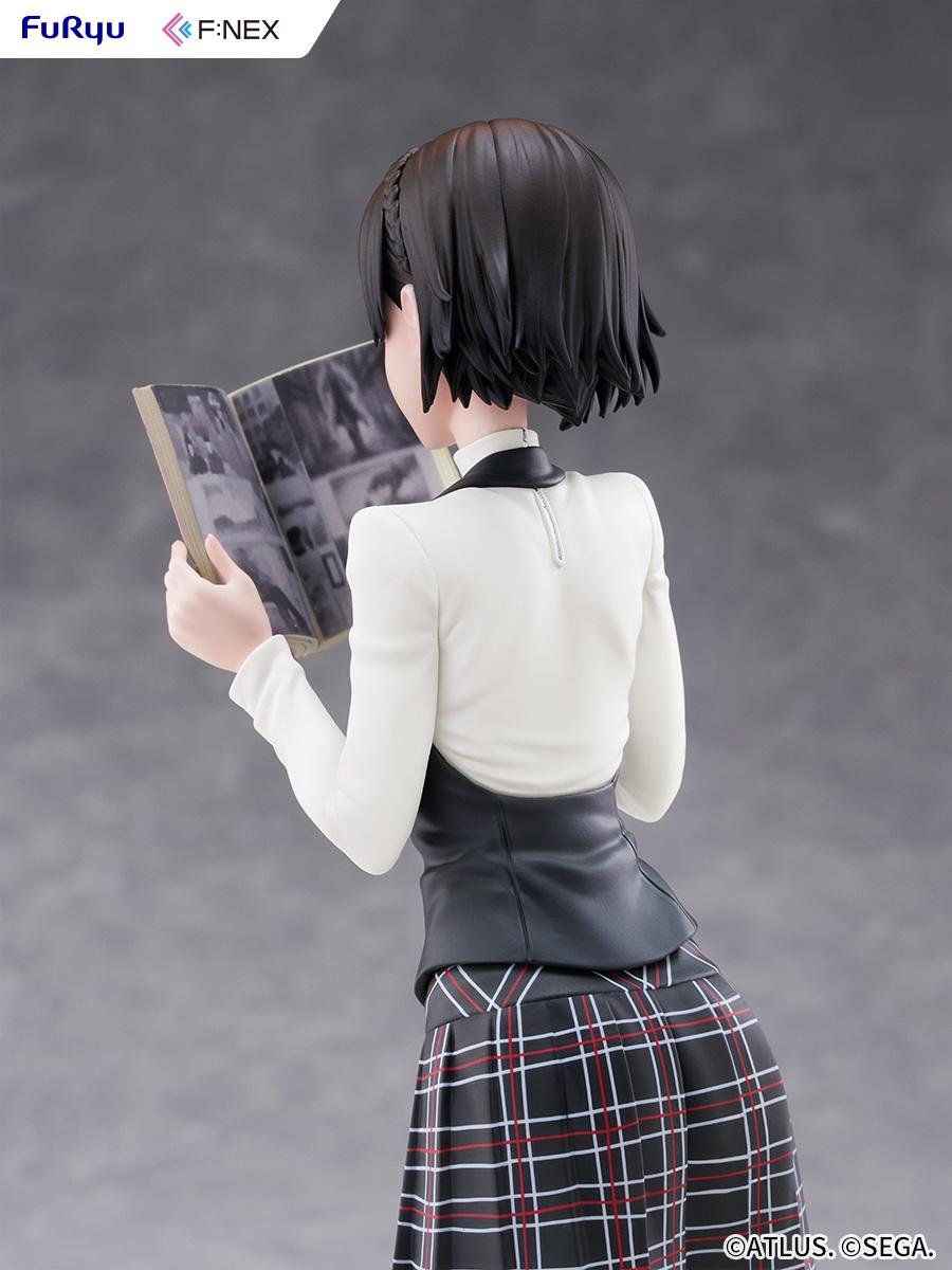 Rear close-up of Makoto Niijima showing the realistic printed black-and-white comic interior pages of the magazine.