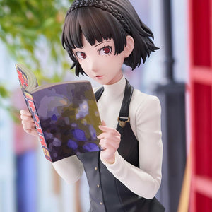 Portrait close-up of Makoto Niijima with a blurred outdoor streetscape and red telephone booth in the background.