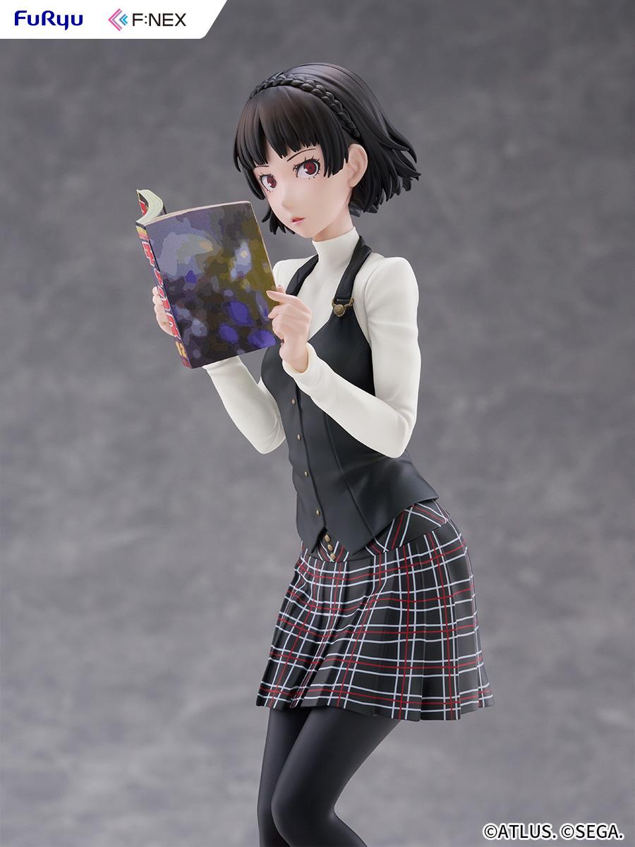 Waist-up shot of Makoto Niijima in her black vest and white turtleneck holding open a colorful manga magazine.
