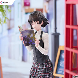 Medium upper-body shot of Makoto Niijima holding the Monthly Shonen Chance magazine in a city street setting.