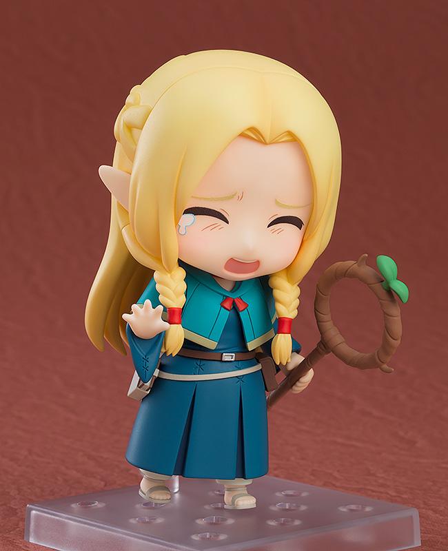 Marcille Nendoroid featuring her crying facial expression with tear details, posing with her Ambrosia staff.