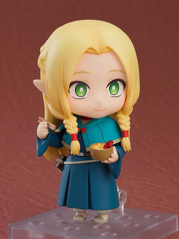 Marcille Nendoroid holding a small bowl of monster hotpot and chopsticks with a content smiling expression.