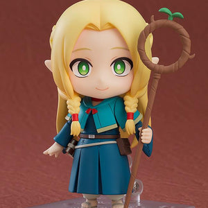 Marcille Nendoroid displayed on a stand with a gentle smiling face plate, holding her signature wooden staff, Ambrosia.