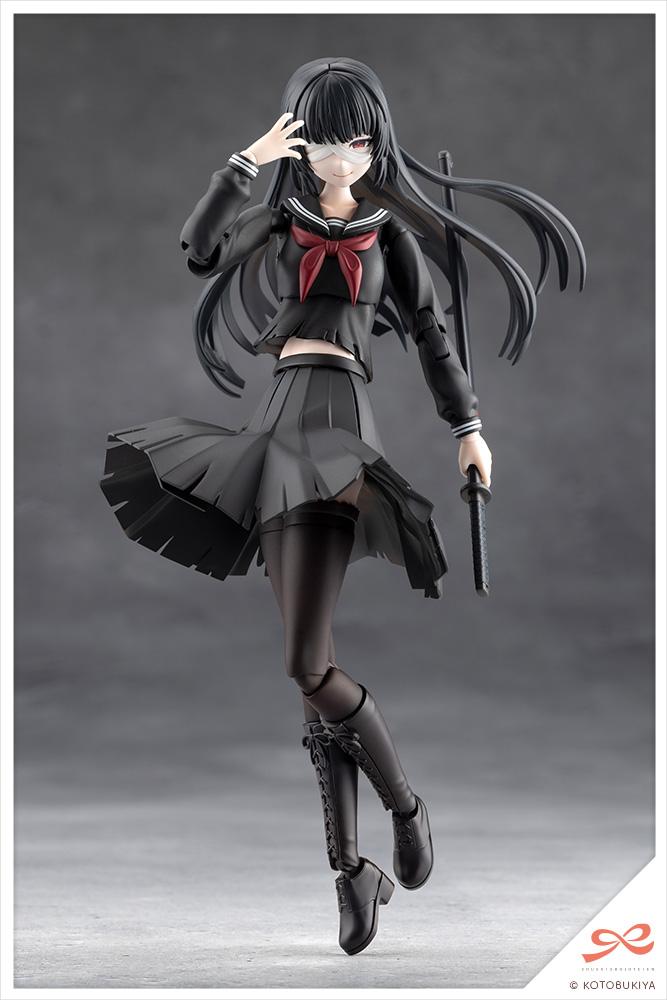 Front view of the black variant figure using her pre-painted bandaged smiling expression part on a studio backdrop.