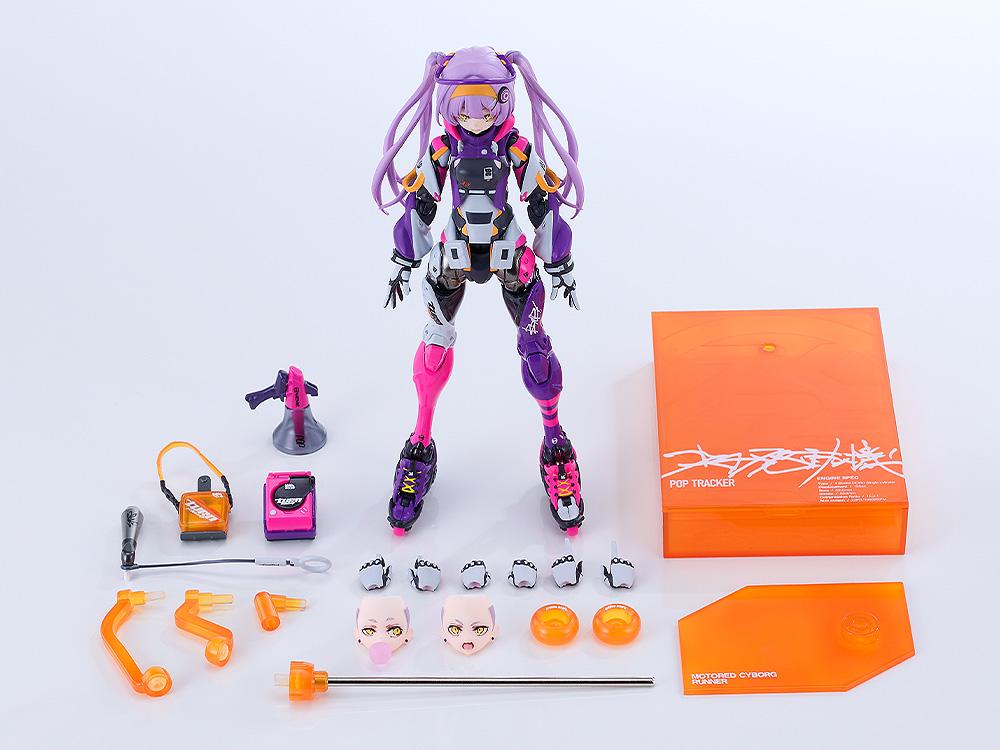 Complete accessories and parts layout for Motored Cyborg Runner Pop Tracker including extra face plates, hands, megaphone, bags, and orange display base.