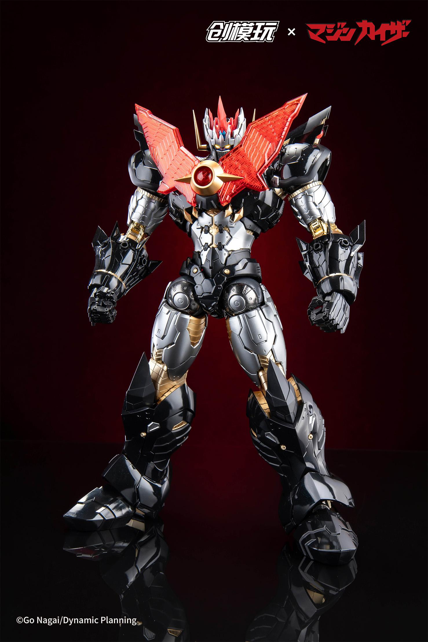Neutral front standing pose of the Mazinkaiser mecha without wings, showing black and gold armor detail.