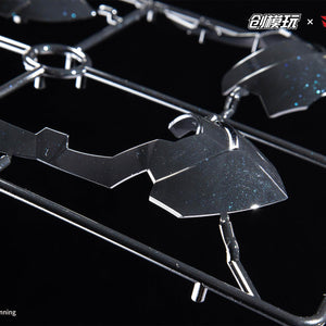 Detailed shot of model kit parts on the runner with a sparkly blue metallic finish.