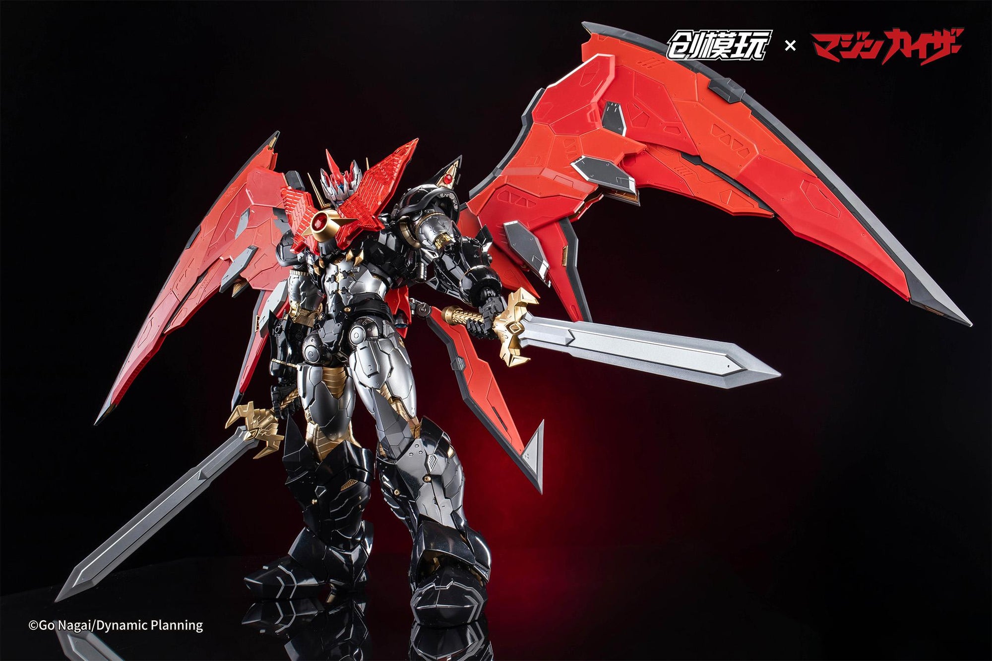 Standing action pose of Mazinkaiser wielding dual Kaiser Blade swords with wings deployed.