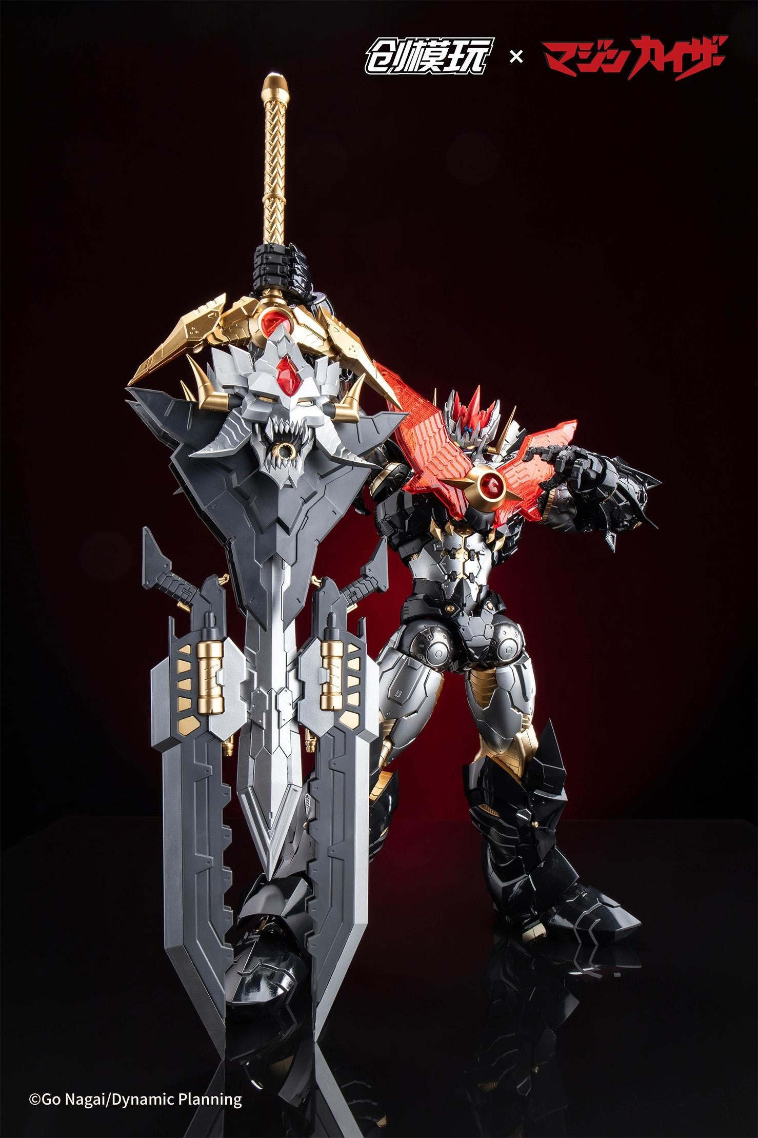 Standing view of Mazinkaiser holding the giant Ultimate Kaiser Blade sword vertically.