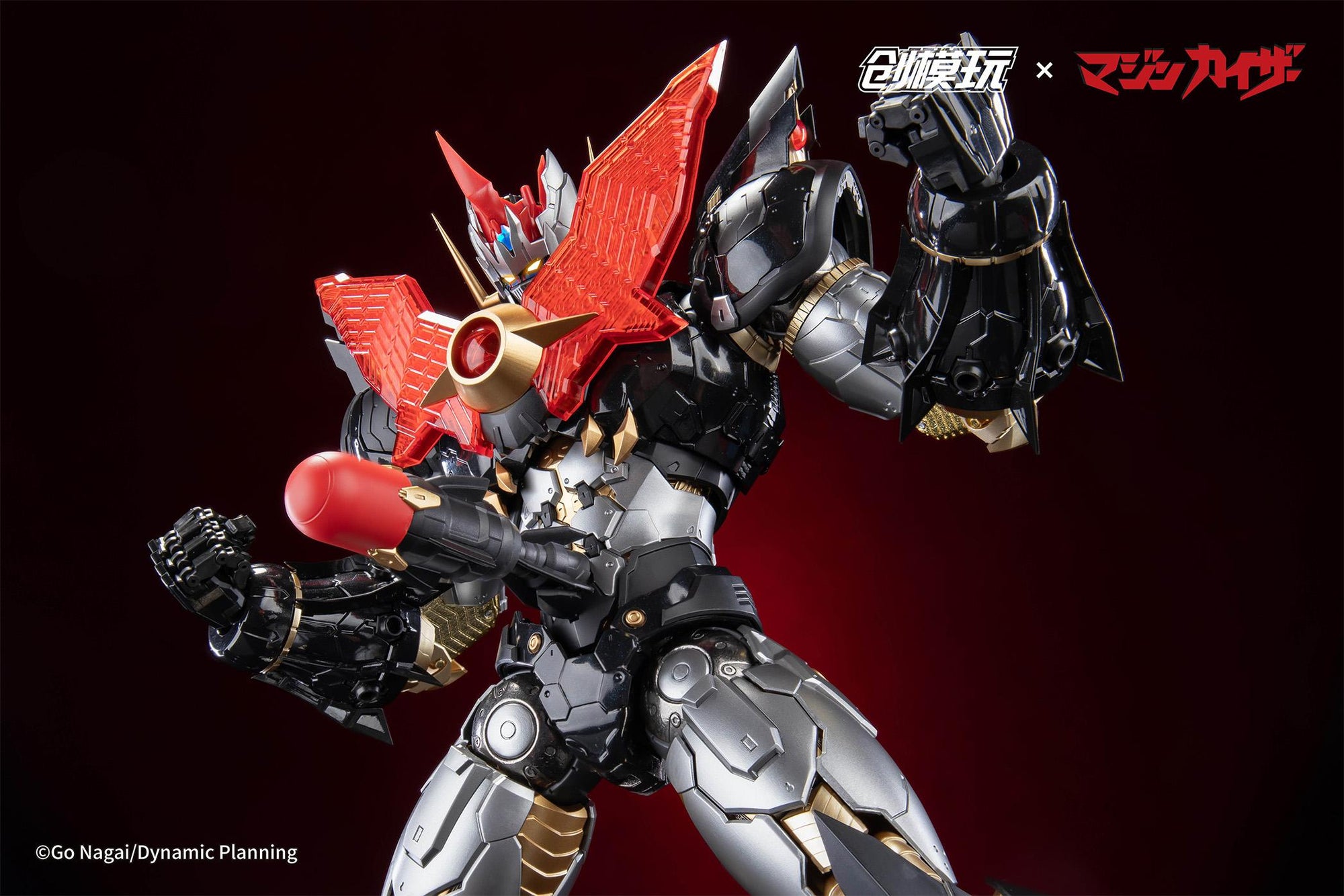 Dynamic mecha action pose of Mazinkaiser with glowing chest LED and translucent orange power effects.