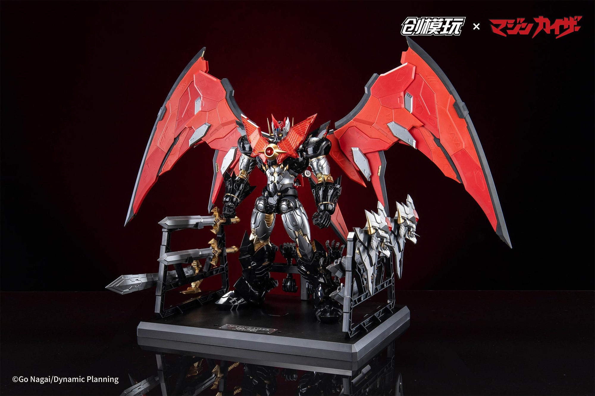 Full display of Mazinkaiser on its custom mechanical base with weapons organized on racks.