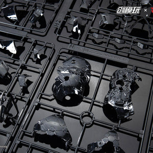 Unassembled black chrome plated model kit runners for the Mazinkaiser mecha armor.