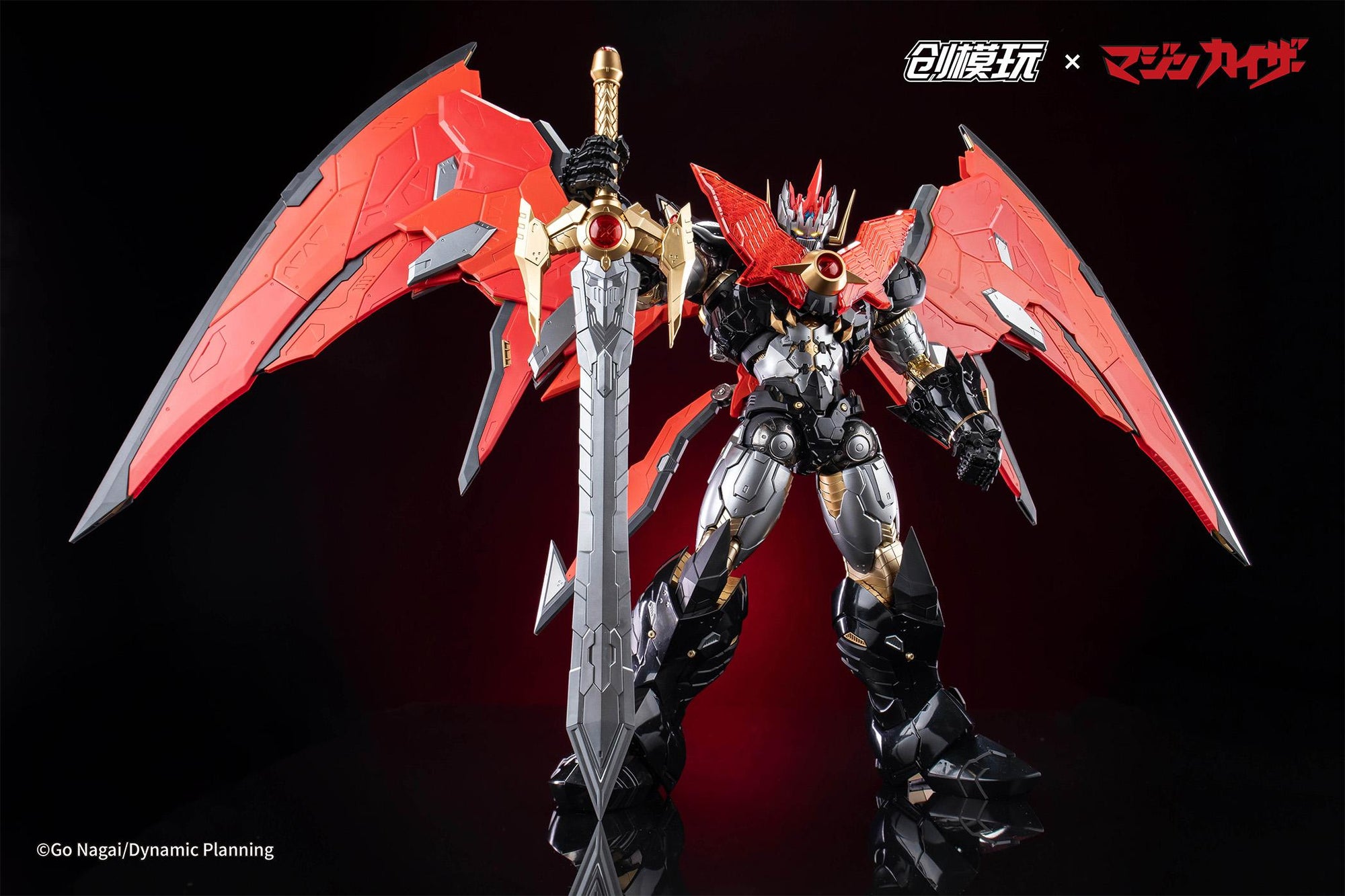 Full body shot of Mazinkaiser holding the large sword with wings spread against a dark background.