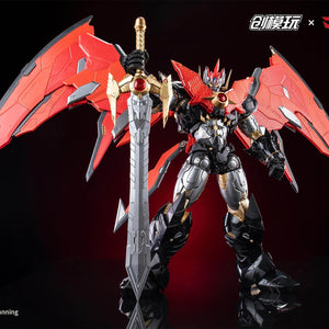 Full body shot of Mazinkaiser holding the large sword with wings spread against a dark background.