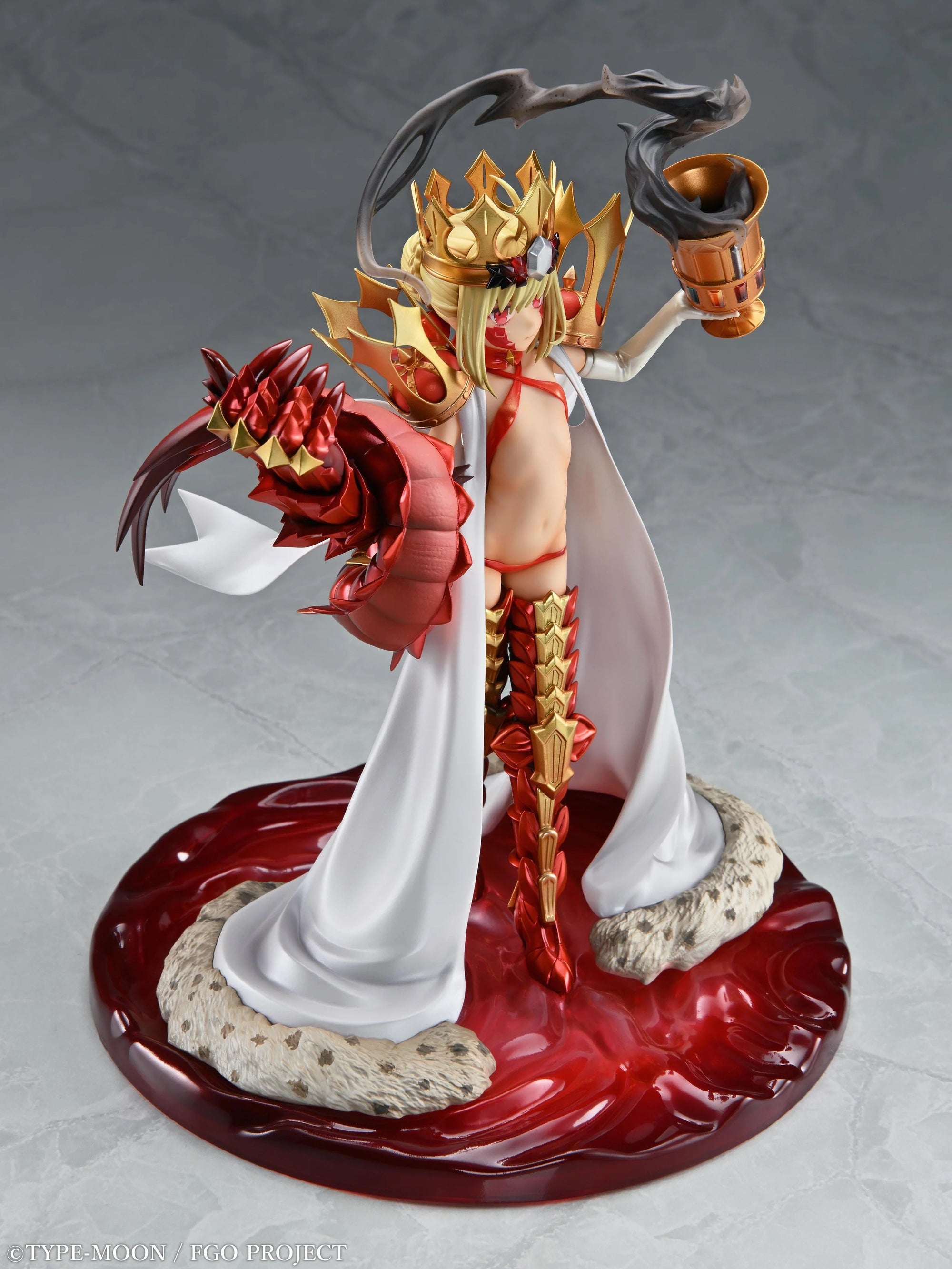 Angled front view of the Beast/Draco figure, clearly displaying the golden chalice and the red, armored dragon claw.