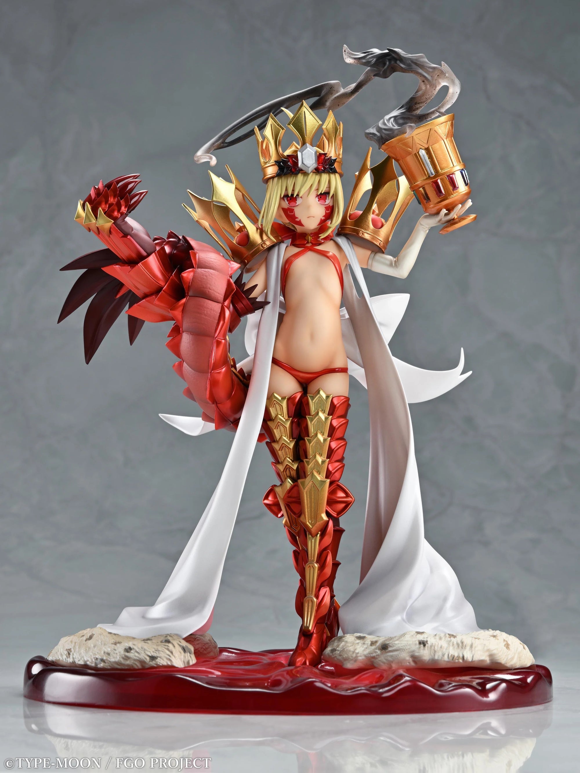 Full frontal shot of the Beast/Draco figure, standing triumphantly and holding the ornate golden chalice.