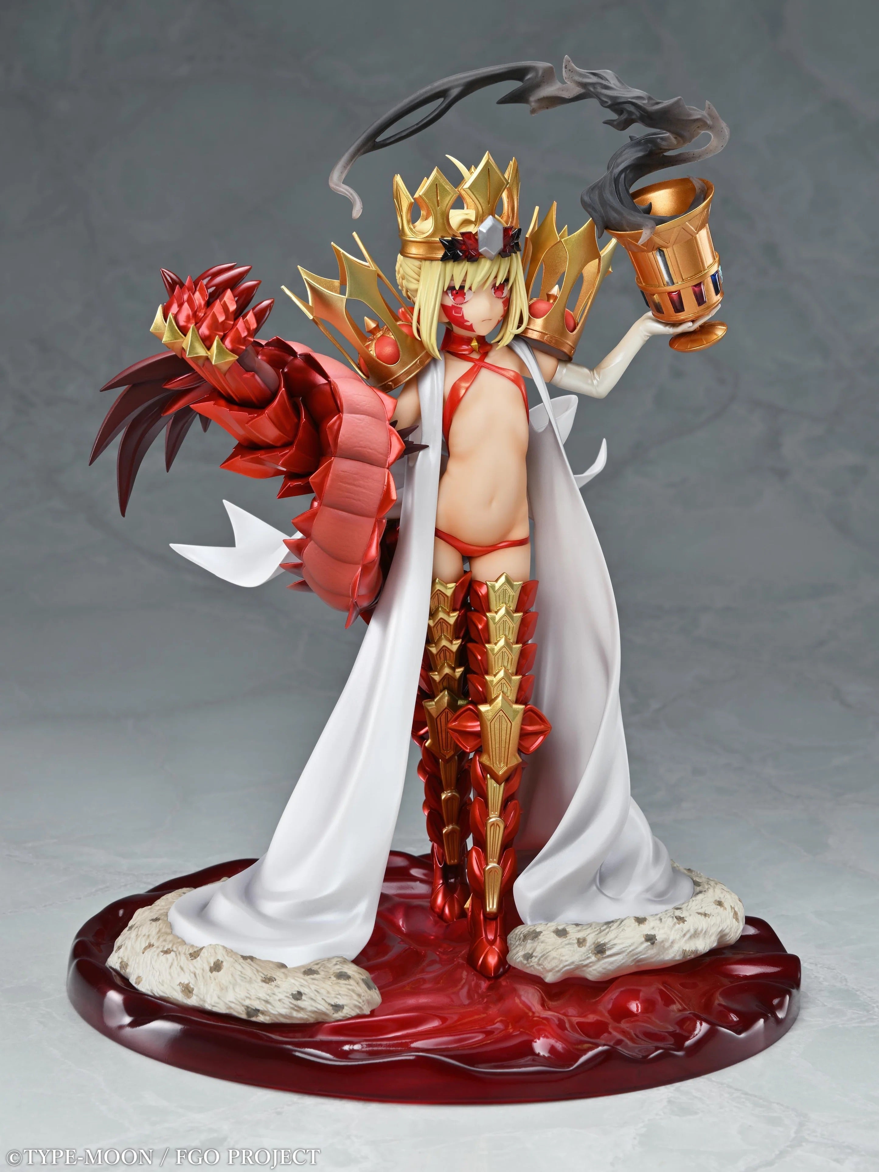 Full frontal view of the Medicos FGO Beast/Draco (Second Ascension) 1/7 Scale Figure, holding the golden chalice and standing in a pool of red liquid.