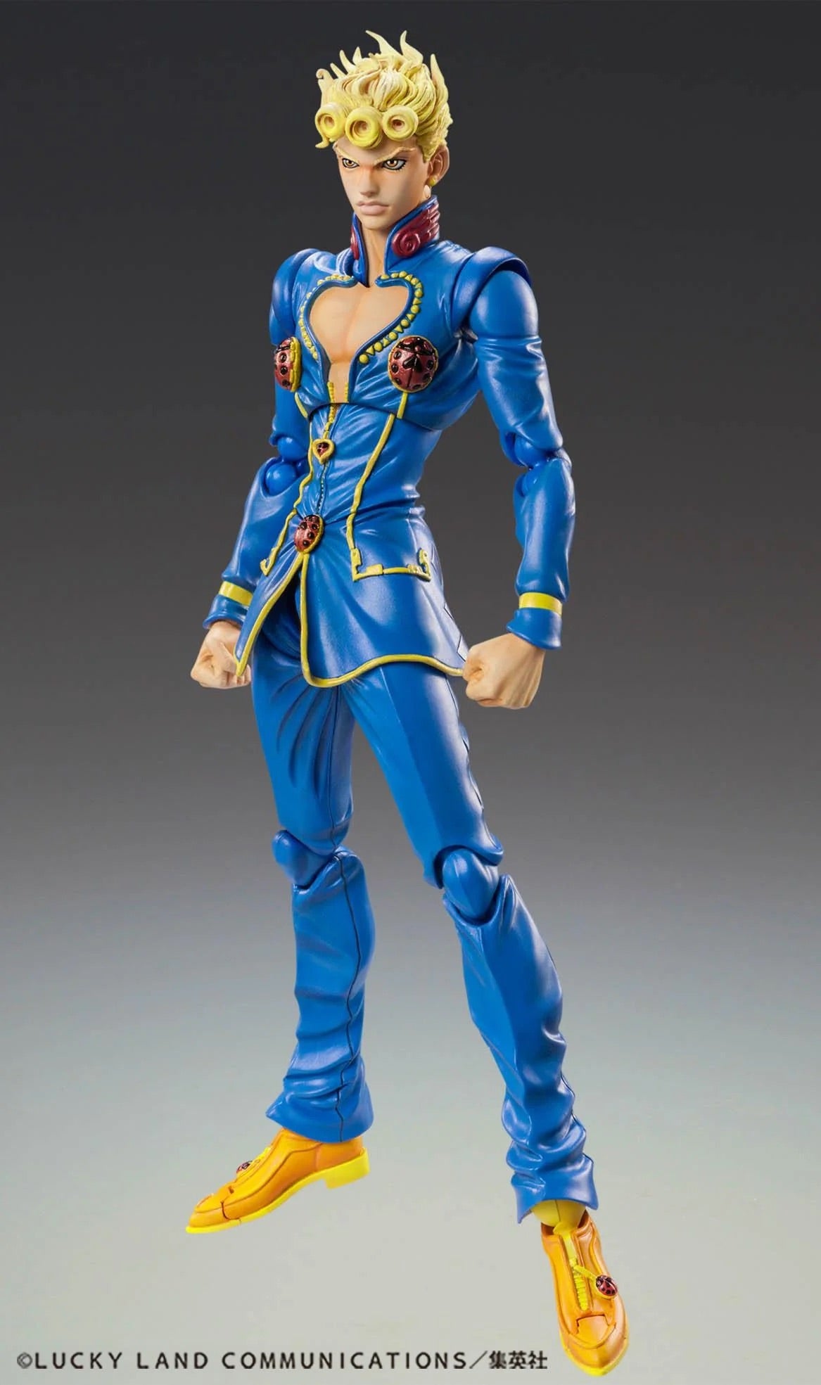 Full body front view of the Medicos Super Action Statue Giorno Giovanna Second figure, posing in his bright blue suit with yellow accents.