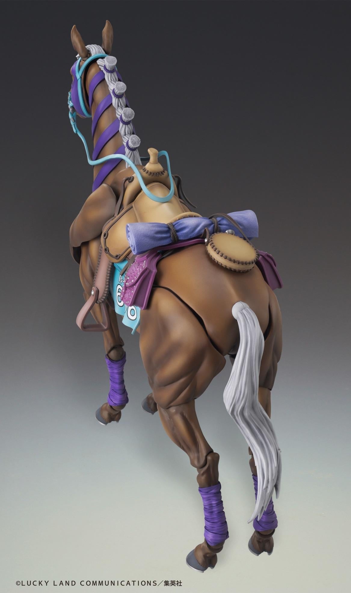 Rear back perspective of Valkyrie horse figure showing detailed leather saddle, bedroll, purple saddlebags, and flowing white tail.