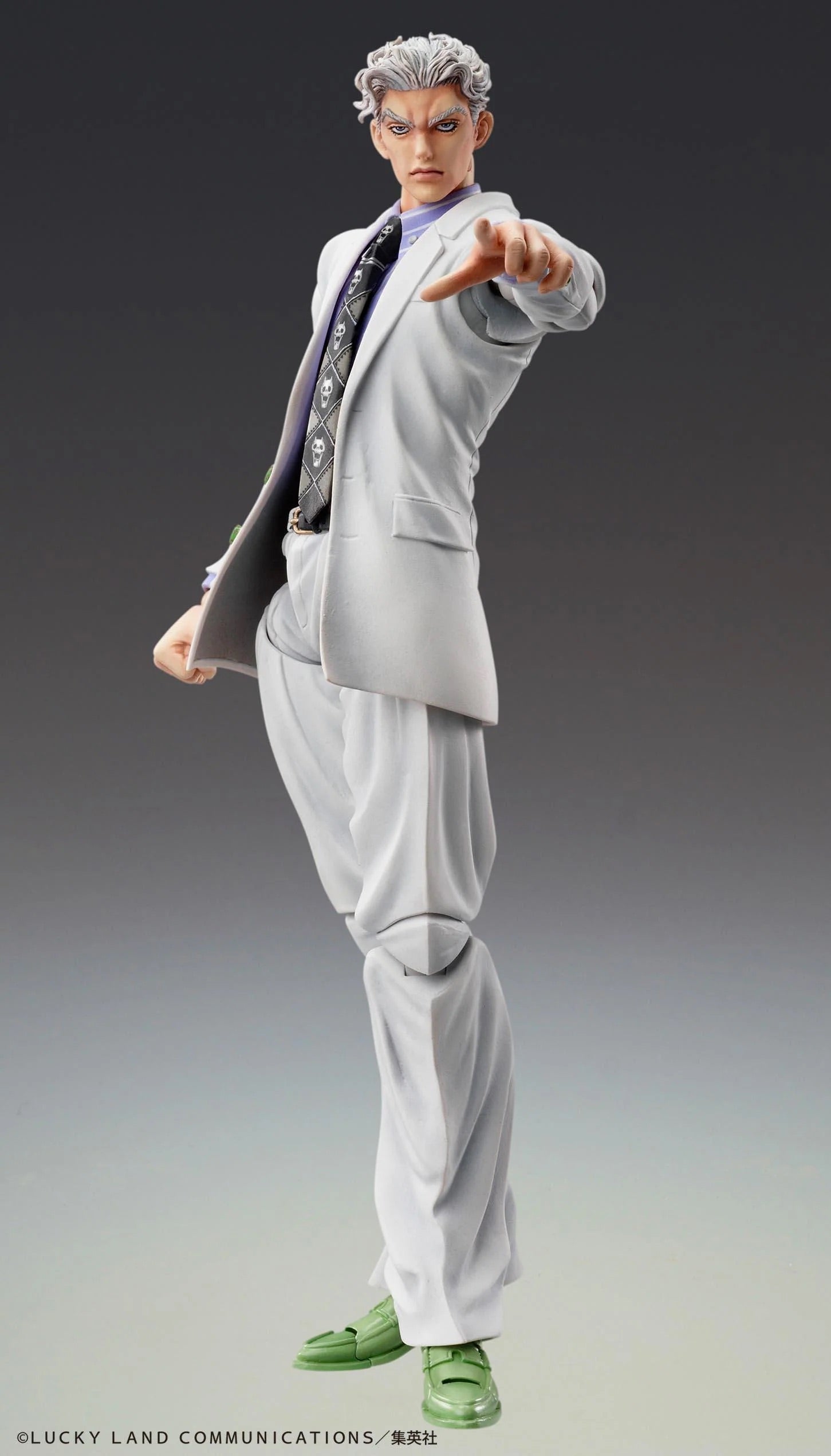 Yoshikage Kira figure in a dynamic pose, leaning forward and pointing, featuring a focused expression and the Killer Queen skull tie.