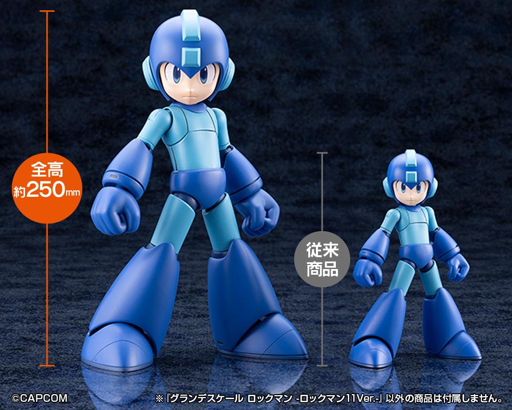 Size comparison showing the 250mm (9.84 inch) Grande Scale Mega Man 11 model kit standing next to a standard Kotobukiya model kit.
