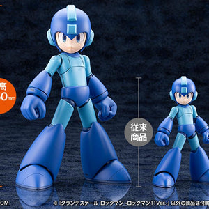 Size comparison showing the 250mm (9.84 inch) Grande Scale Mega Man 11 model kit standing next to a standard Kotobukiya model kit.
