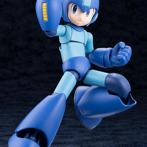 Action pose of Mega Man charging his Mega Buster displaying the yellow power gauge with teeth-clenched face plate.
