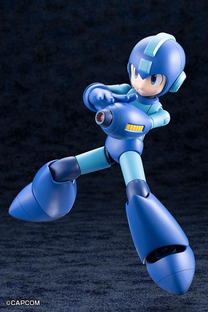 Dynamic airborne stance of the Grande Scale Mega Man 11 kit aiming the Mega Buster downward with two hands.