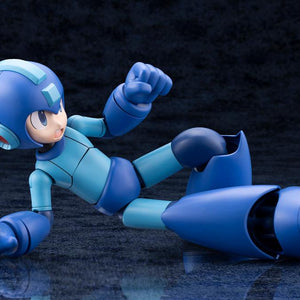 Kotobukiya Mega Man 11 Grande Scale model kit posed in a ground slide maneuver with an open shouting face plate.